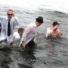 FEELING SOULFUL—The Blues Brothers of the First Congregational Church of Rockford jump into the icy Rogue River not once, not twice, but three times Saturday and earn the trophy in the group division.